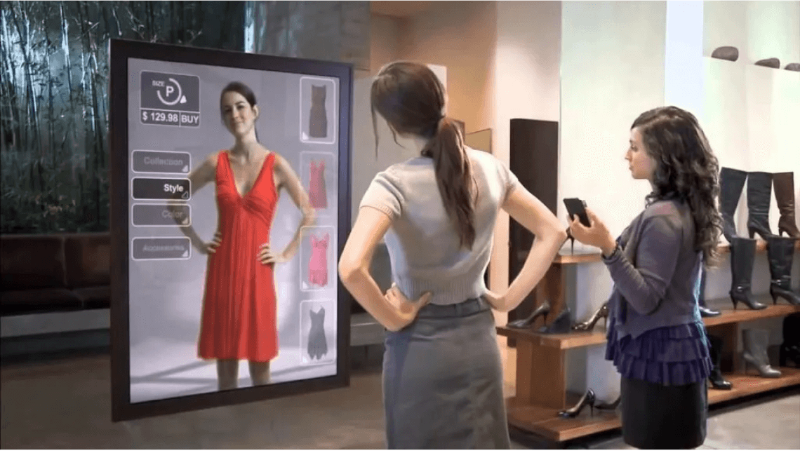 Shopping assistant helping a customer during a smart mirror shopping experience